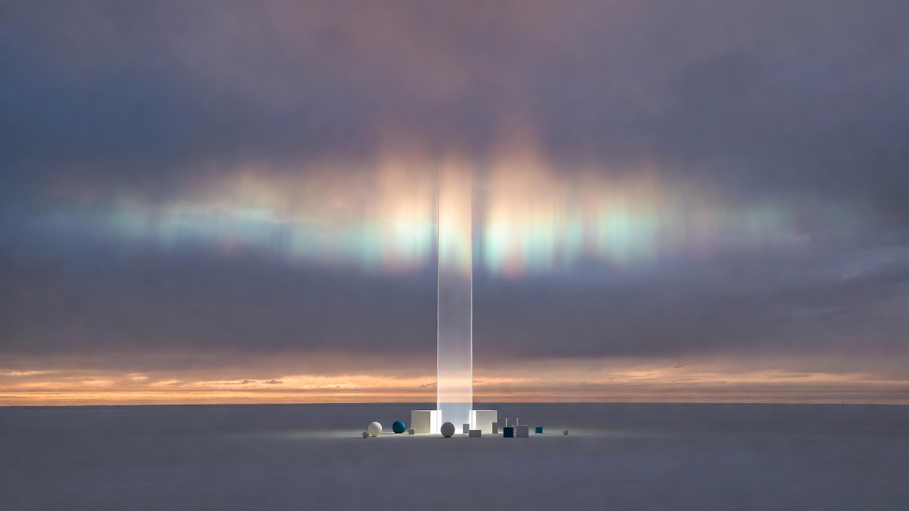 A vast, quiet sky at twilight, where the horizon is a thin, golden line between land and air.